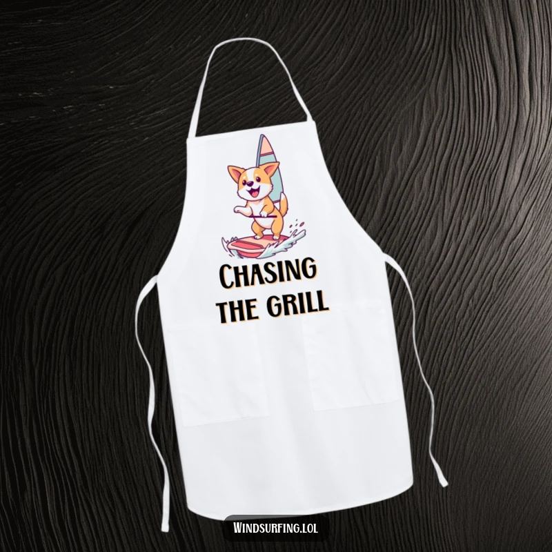 Funny Apron: A happy dog catching air while windsurfing, perfect for kitchen adventures or outdoor grilling.