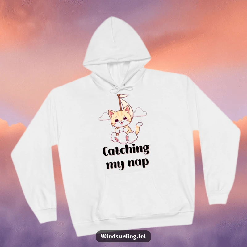 Funny hoodie depicting a smiling cat sailing, using its sail to catch a whimsical puffy cloud.