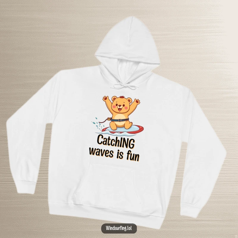 Funny hoodie depicting a happy bear windsurfing joyfully, arms waving, radiating fun and carefree spirit.