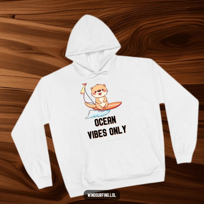 Funny Otter Surfing Hoodie: A happy otter enthusiastically surfs, holding a sail, embodying pure surfing joy.