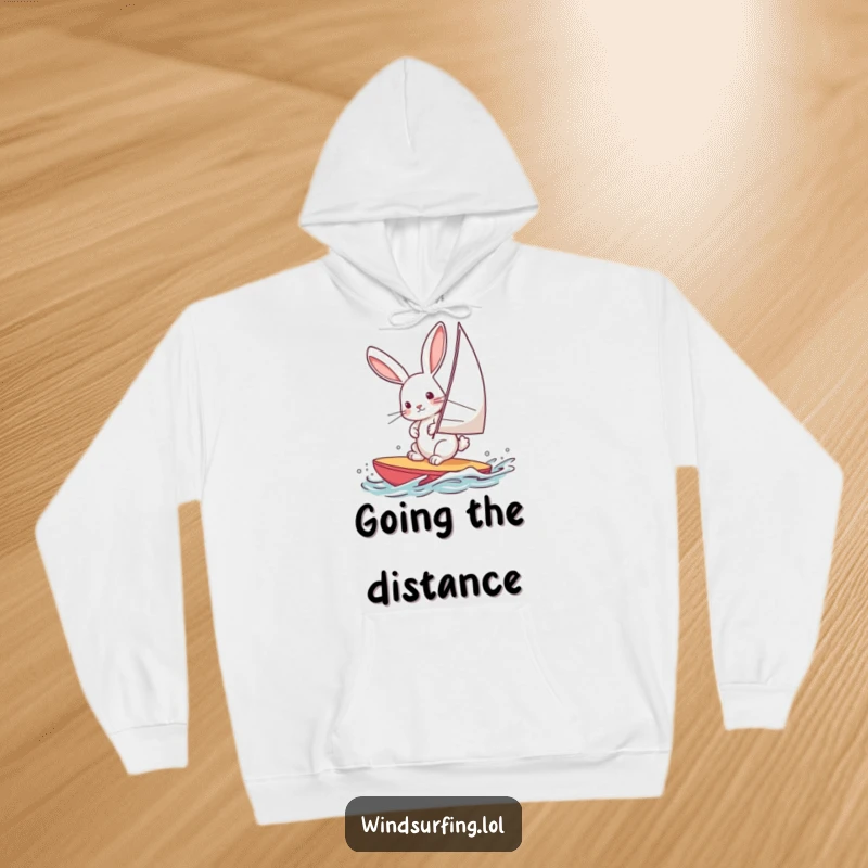 Funny hoodie with a curious rabbit windsurfing, leaning into the wind, conveying adventure and fun, perfect for cozy, humorous wear.