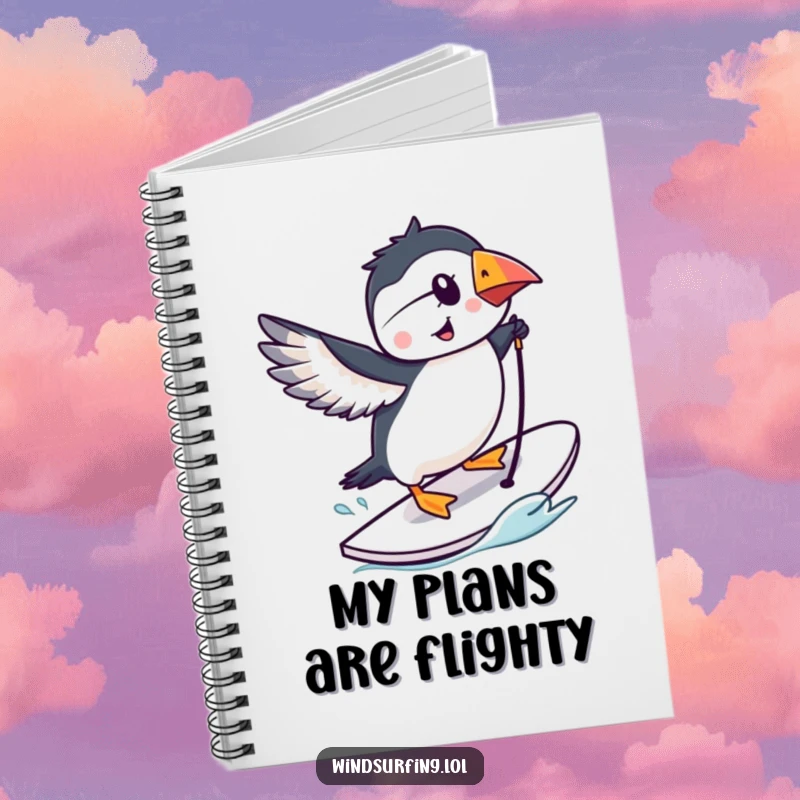 Funny puffin performing a trick on a windsurfing board, lined notebook, cartoon bird cover.