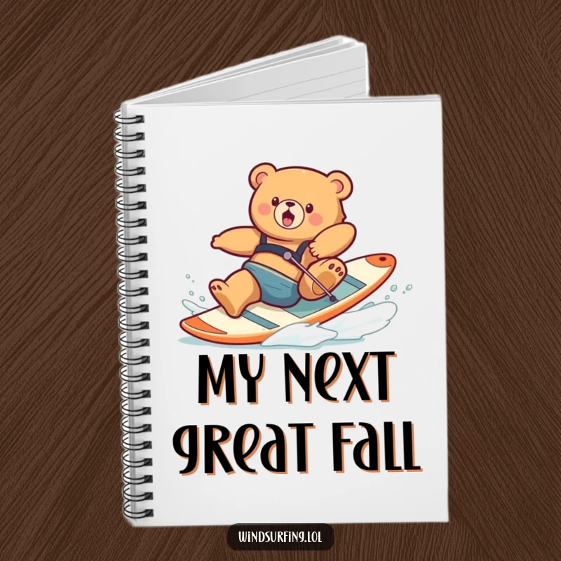 Funny notebook cover with a clumsy bear spectacularly falling off a windsurfing board, inspiring humor in note-taking.
