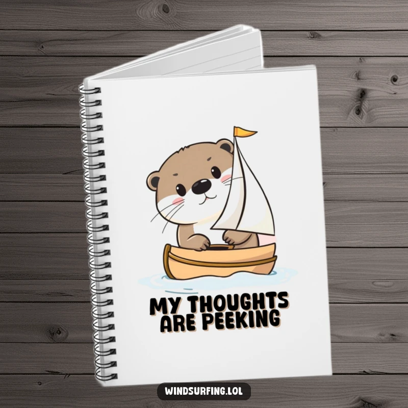 Funny otter peeking from a small sailboat on a notebook cover, inspiring creative writing and journaling with its whimsical design.