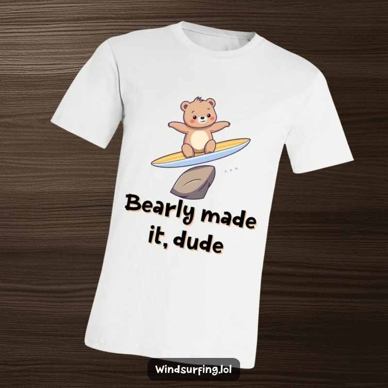 Funny t-shirt of a bear comically falling off a surfboard while attempting to ride a big wave, embracing the chaos.