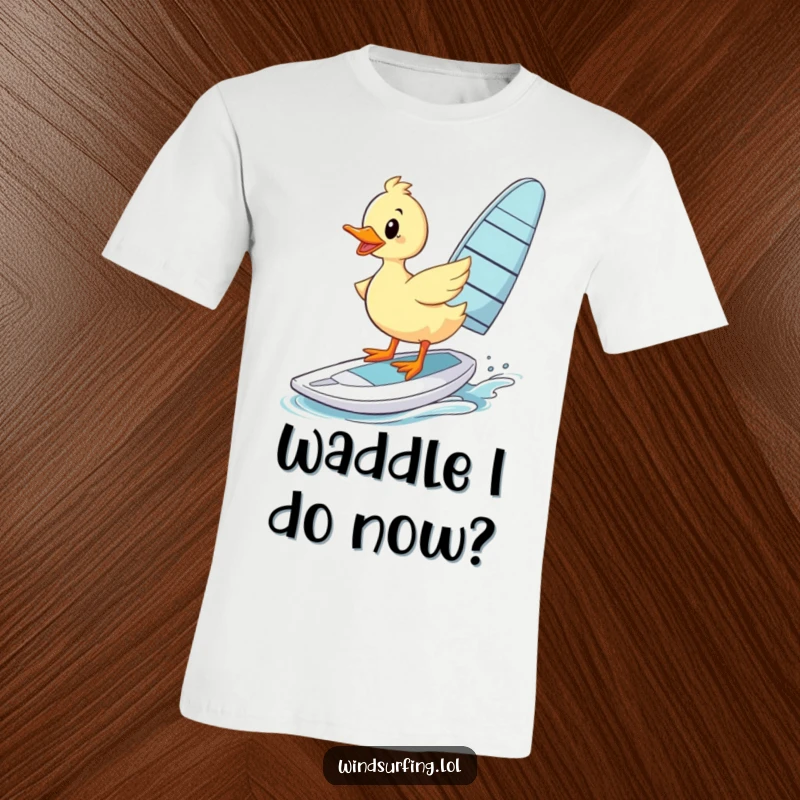Funny T-Shirt: A duck wobbles precariously on a windsurfing board, a funny display of effort.