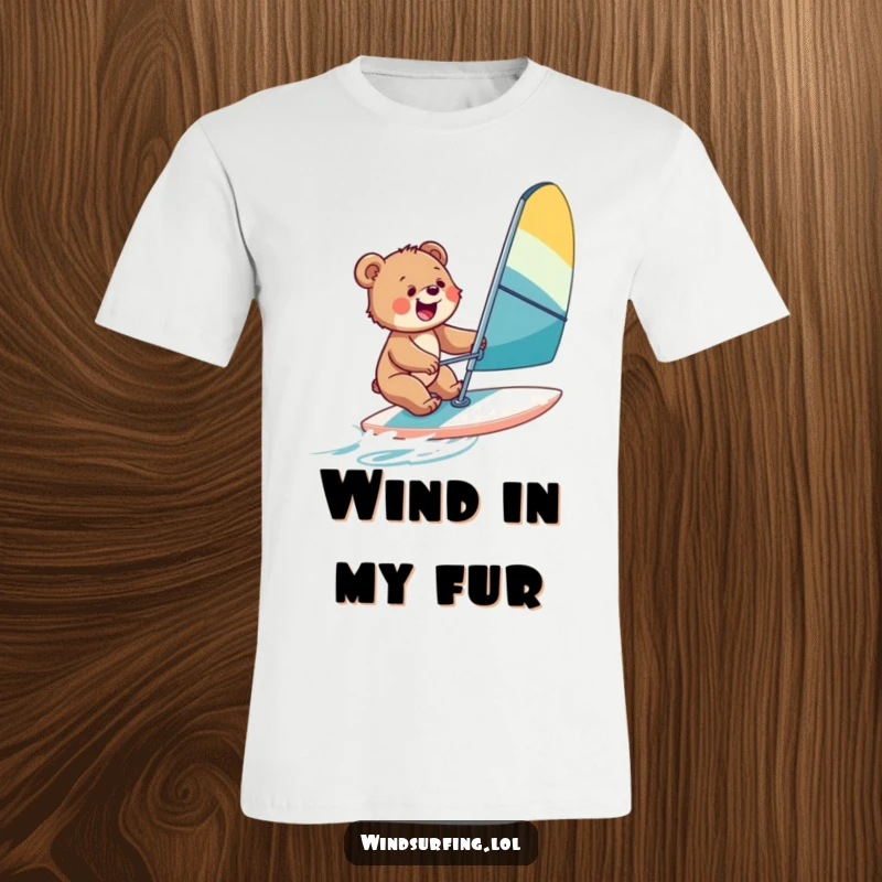 Funny t-shirt depicting a joyful bear cub windsurfing with enthusiasm, representing adventure and playful spirit.